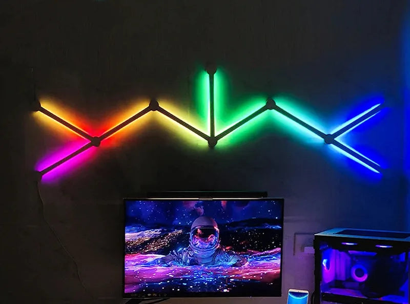 Barras LED Nekoa Lines en zigzag sobre un televisor, encendidas en rojo, verde y azul